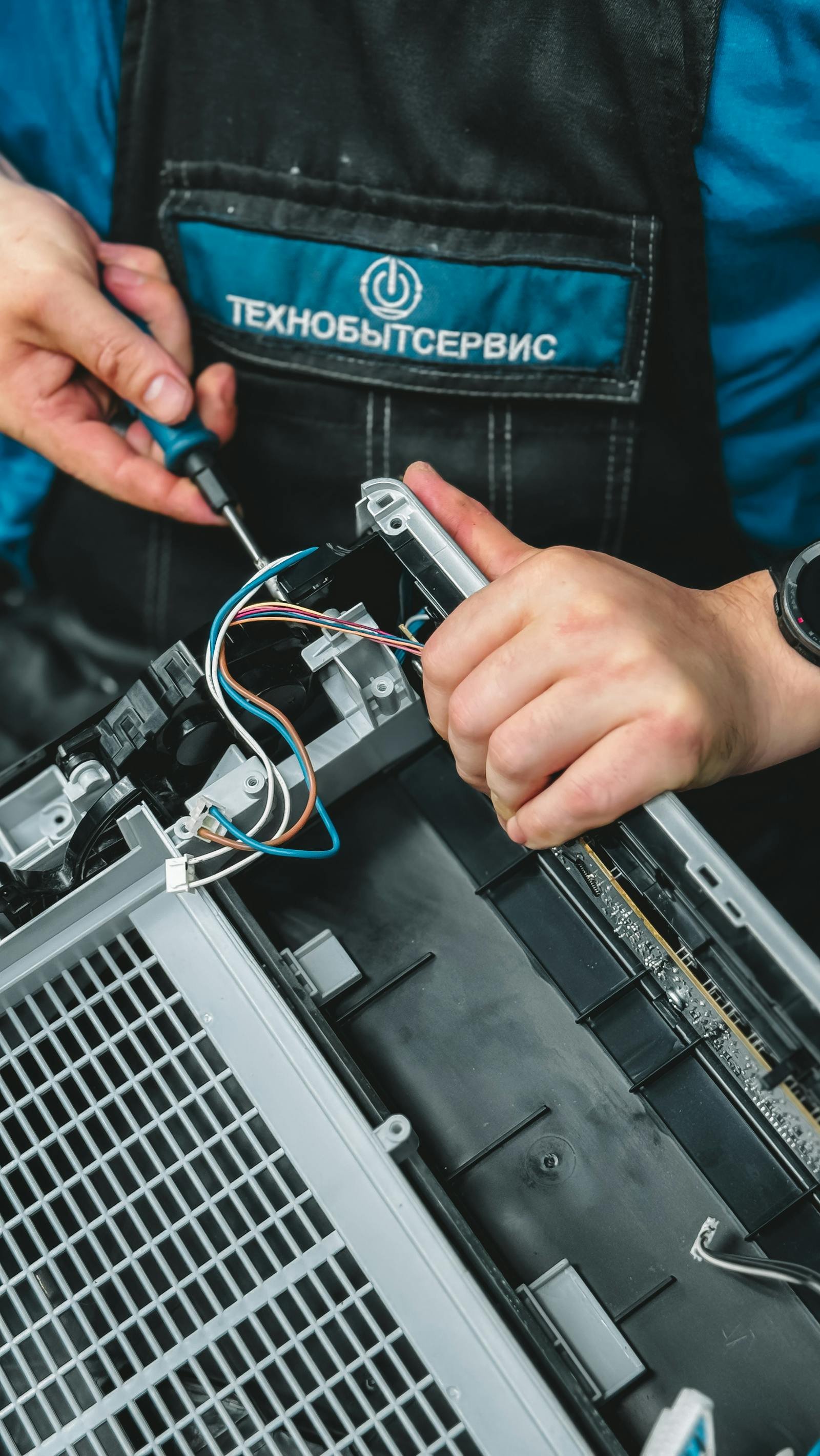 Technician troubleshooting and repairing Dryer Repair